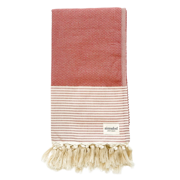 Red and white striped artisan towel with tassel fringe.