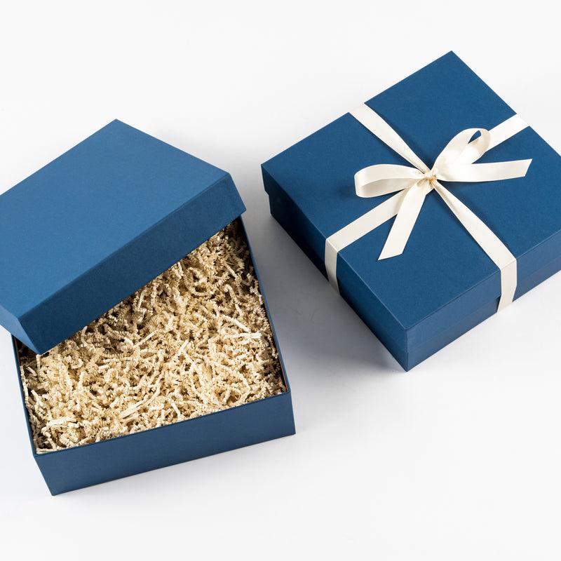 Santa Barbara Company blue gift box with white ribbon